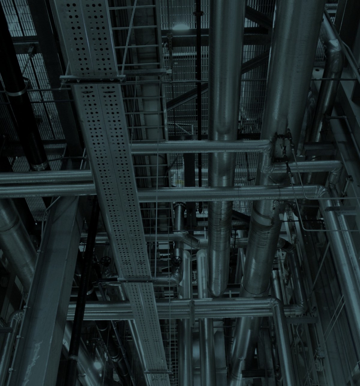 Mechanical plant room services — pipework, valves and cable containment ready for commissioning